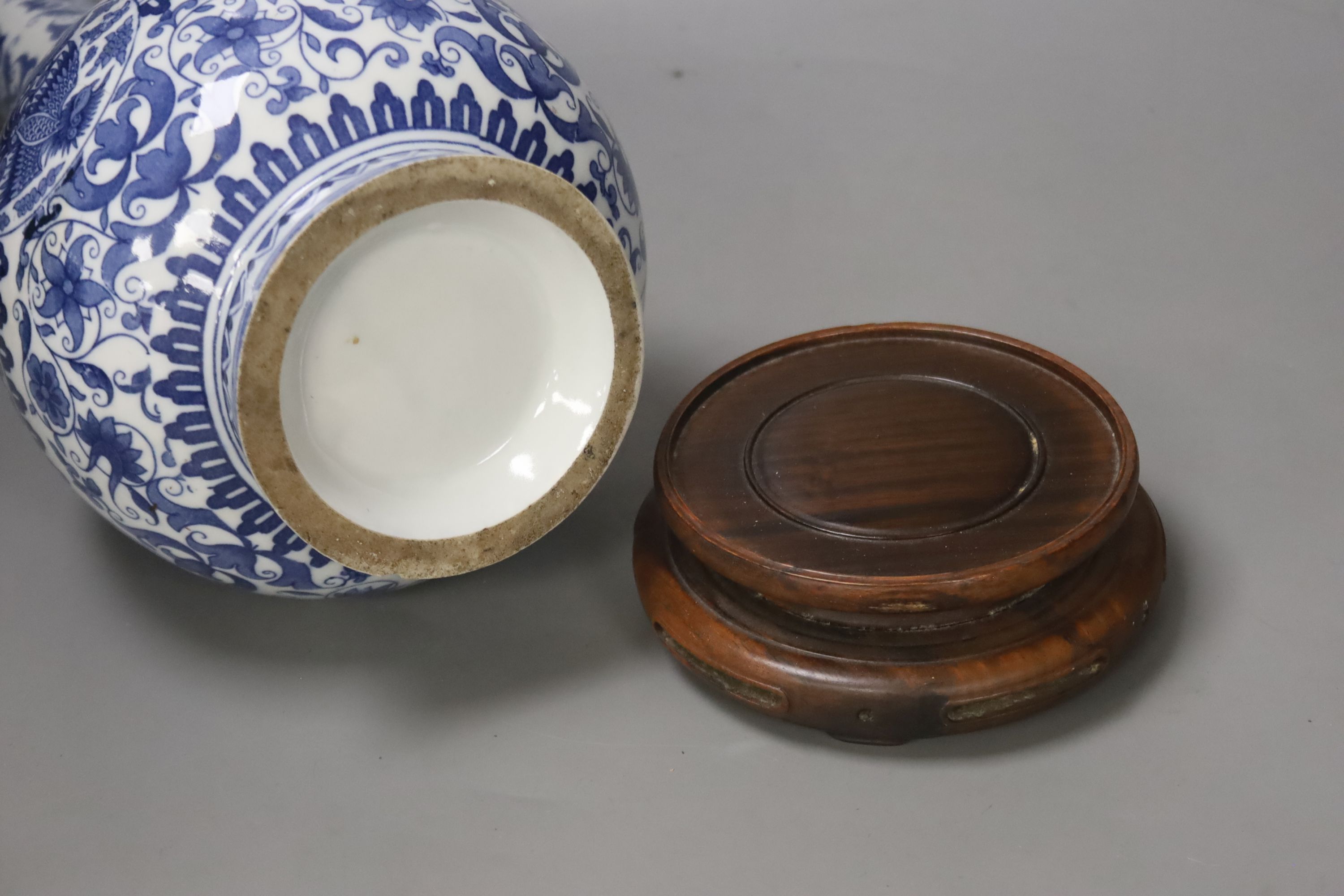 A Dutch porcelain blue and white long necked bottle vase